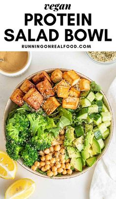 a salad bowl with broccoli, chickpeas and avocado in it