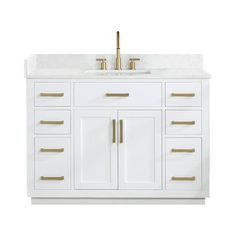 a white bathroom vanity with gold handles and drawers