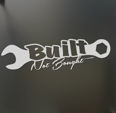 an image of a logo on the side of a car that says built not bought