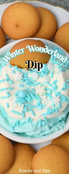 a white plate topped with blue frosting and cookies