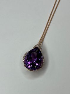 EFFY 14K Rose Gold Amethyst & Diamond Pendant Necklace. This necklace features 34 round cut diamonds and one pear cut amethyst stone measuring 20.5mm x 14.90mm (total of 14.50 carats). This necklace is 18 inches in length; pendant is 1 inch in length and 3/4 inch in width, and weighs a total of 8.14 grams. Chain and pendant are tested and stamped 14k gold; the pendant is also stamped "EFFY". This pre-owned necklace is in good condition and is ready to be worn! Necklace is exactly as shown in pho Luxury Amethyst Necklace With Diamond Accents, Luxury Purple Diamond Necklace, Luxury Purple Drop Jewelry, Luxury Purple Pear-shaped Jewelry, Luxury Purple Teardrop Jewelry, Luxury Teardrop Amethyst Jewelry, Teardrop Amethyst Necklace For Formal Occasions, Formal Teardrop Amethyst Necklace, Elegant Purple Pear-shaped Necklace