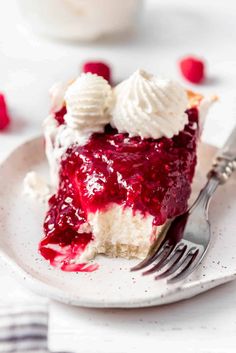 a piece of pie with whipped cream and raspberry sauce