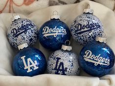 six dodgers christmas ornaments in blue and white glittered glass ornament style balls