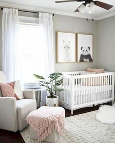 a baby's room with white furniture and pink accents