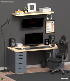 a computer desk with a monitor, keyboard and speakers