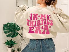 In My Thirties Era Sweatshirt Trendy Funny 30th Birthday Crewneck cute 30th Birthday Gift Trendy Womens Oversized Sweater 30th Birthday Hoodie Production time: 1 day Shipping time: 2 to 5 days ☀️ Product Details Unisex heavy blend Crewneck Sweatshirt There are no itchy side seams on these sweaters. 50% cotton, 50% polyester Medium-heavy fabric (8.0 oz/yd² (271.25 g/m Loose fit Runs true to size Unisex heavy blend Hoodie 50% cotton, 50% polyester (fiber content may vary for different colors) Medi Birthday Sweater, Preppy Sweatshirts, Birthday Sweatshirt, New Aunt, Travel Tops, Purple Sweatshirt, Aesthetic Hoodie, Retro Sweatshirts, Godmother Gifts