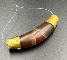 The Beautiful Crescent Moon Shape Amulet Banded Agate Bead Wrapped In Gold Probably From Ancient Historic Cultures Civilizations Of South East Asian Regions. Size Details Pictures Are Listed Above. Good Conditions As Shown In The Pictures. Quite Big Size Bead. We Provide Fast And Free Shipping Service World Wide To Our Customers .We Ship Mostly Via Fedex And DHL. If You Have Any Questions Please Feel Free To Send Us Message. Artisan Gold Beads, Gems, And Cabochons, Artisan Gold Gemstone Beads And Cabochons, Gold Agate Beads For Jewelry Making, Moon Beads, South East Asian, Moon Shape, Details Pictures, Bead Pendant, East Asian