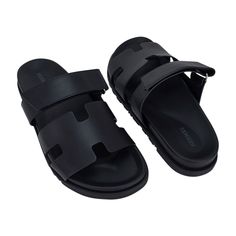 Guaranteed authentic Hermes Men's Chypre Sandal featured in Noir.Black calfskin with black anatomical insole and H embossed Black rubber sole.Strap across foot is adjustable with velcro closure.Comes with sleepers. NEW or NEVER WORN. final saleSIZE 43 USA SIZE 10 SHOE MEASURES:HEEL 1"UPPER SOLE 11"CONDITION: NEW or NEVER WORN Hermes Men Sandals, Hermes Sandals Men, Men Leather Sandals Fashion, Hermes Slippers, Husband Clothes, Shoes Png, Money Clothes, Hermes Men, Designer Slippers