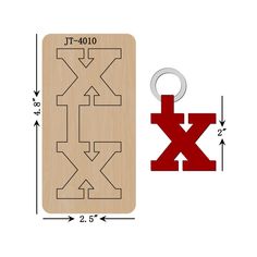 a wooden keychain with the word x on it and an arrow shaped design