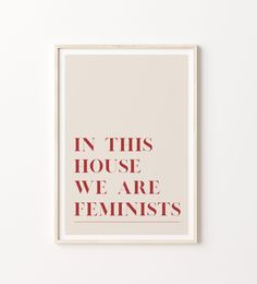 a poster with the words in this house we are feminists on it, against a white background