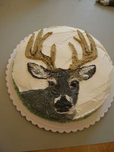 there is a cake decorated to look like a deer's head with antlers on it