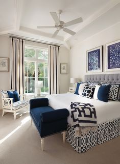 a bedroom with white walls and blue accents