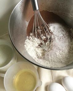 an image of eggs and flour in a bowl