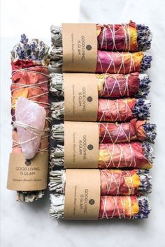 six bundles of dried flowers wrapped in twine