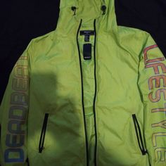 Neon Green Windbreaker With Zipper Front Closure Trendy Hooded Sports Outerwear, Fall Streetwear Yellow Hooded Jacket, Trendy Yellow Hooded Outerwear, Yellow Hooded Jacket For Fall Streetwear, Casual Yellow Outerwear With Double-lined Hood, Casual Yellow Outerwear With Drawstring Hood, Trendy Yellow Hoodie For Spring, Trendy Yellow Spring Hoodie, Yellow Outerwear With Adjustable Hood For Streetwear