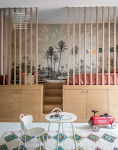 a child's room with a play table and toy cars