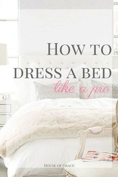 a bed with white sheets and pillows in a bedroom next to a window that reads, how to dress a bed like a pro