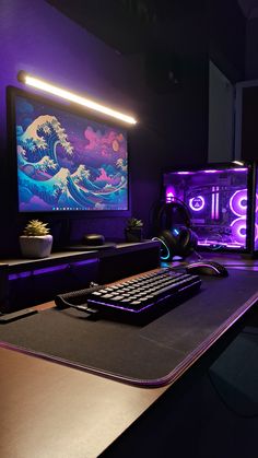 a desk with a keyboard, mouse and monitor on it in front of a painting