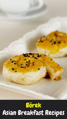 two pieces of bread sitting on top of a white plate