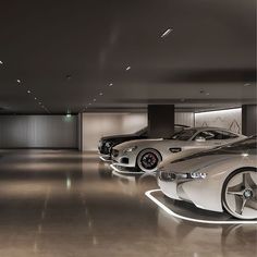 several cars are lined up in a showroom