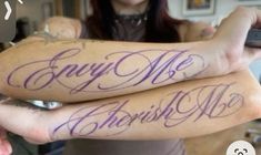 two people with purple ink on their arms