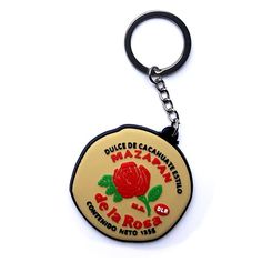 a keychain with a rose on it that says,'dulce de caanantato san francisco and rio roja