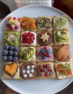 a white plate topped with lots of different types of food on top of each other