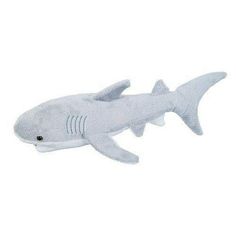 a stuffed shark is shown on a white background