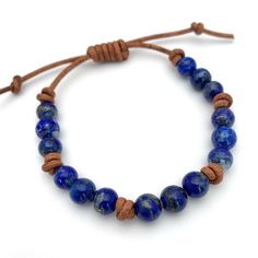 Rustic brown leather and blue Lapis Lazuli gemstones. The Lapis stones have beautiful blue color and are flecked with golden pyrite. These bracelets look great alone or stacked together and with other bracelets. The classic look of gemstones with modern and edgy leather. Groups of three gemstones knotted together around a leather bracelet. Finished with a sliding knot clasp. The clasp adjusts to help you get the perfect fit. Slide the leather knot over the bracelet straps to open up the bracelet Brown Leather Bracelet, Blue Lapis Lazuli, Sliding Knot, Blue Lapis, Rustic Brown, Beautiful Blue, Lapis Lazuli, Leather Bracelet, Brown Leather