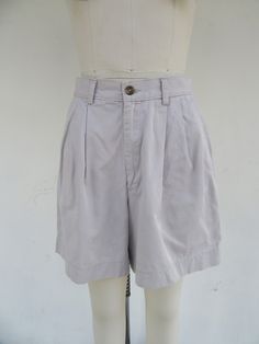 90s high waist pleated khaki shorts.  All cotton. Side pockets plus one back pocket with button and flap closure. Made in Zimbabwe for EDDIE BAUER.  Label size 8 28" Waist  12" rise 41" hips 5-1/2" inseam Good vintage condition with light signs of use and age. 90s Mom, High Waist Shorts, Mom Shorts, Khaki Shorts, Zimbabwe, Label Sizes, Pretty Earrings, Skorts, Eddie Bauer