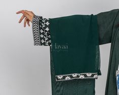 Introducing our Lana Embroidered Sleeve Abaya Collection, where each piece features exquisite sleeve embroidery that adds a touch of elegance perfect for both casual and formal wear. These versatile abayas are crafted for comfort and style, making them perfect to wear to university. Blend practicality with sophisticated design, ensuring you look and feel your best. Features: Perfect for University: The abayas in this collection are ideal for university wear, offering a blend of comfort, practica Traditional Hijab For Eid, Eid Festive Abaya With Floral Embroidery, Festive Floral Embroidered Abaya For Eid, Green Abaya With Dabka Work, Traditional Drape Abaya With Resham Embroidery, Green Dabka Work Abaya For Eid, Traditional Green Abaya For Eid, Traditional Long Khimar For Eid, Green Long Abaya With Dabka Work