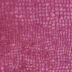 the texture of an upholstered fabric in pink