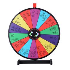 a wheel of fortune with words written on the sides and numbers painted on each side