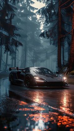 a black sports car driving on a wet road in the woods at night with bright lights