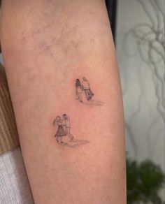 two small tattoos on the legs of people