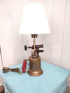 a lamp sitting on top of a blue table