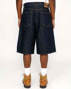 Baggy short in 14.5oz cotton denim. Oversized waist with a relaxed rise and roomy cut. Features branded nickel shank hardware and a suede Stüssy logo patch. Size down for a true-to-size fit in the waist, or order your normal size for a baggier fit. - Button fly - Belt loops - Five pocket styling - Swirly "S" embroidered on coin pocket - Oversized fit - Relaxed rise - Extra wide cut - Unisex - Size 32 inseam: 10 ½" / 26.8cm - Size 32 leg opening: 27" / 68.6cm - Material: 100% cotton - Imported Big Shorts, Baddie Vibes, Baggy Shorts, Short Denim, Knit Shirt, Baggy Fits, Shirt Accessories, Denim Pants, Short Pants