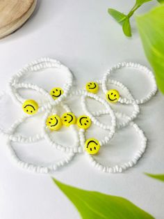 Playful White Friendship Bracelets For Summer, Playful Smiley Face Jewelry For Friendship, Adjustable Smiley Face Round Bead Bracelets, Handmade White Beaded Bracelets With Fun Style, Fun White Beaded Friendship Bracelets, Beach Jewelry With Smiley Face Round Beads, Fun Smiley Face Bracelets, Fun Summer Jewelry With Smiley Face, Playful Smiley Face Friendship Bracelets