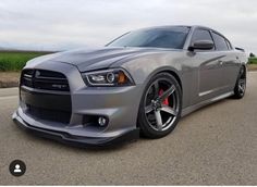 the front end of a silver dodge charger