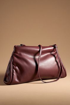 Polyurethane; polyester lining Removable crossbody strap One inner zip pocket Zipper styling Imported | Oversized Pillow Clutch by Anthropologie in Purple, Women's, Polyester Oversized Pillow, Oversized Pillows, Oversized Style, 50 Fashion, Crossbody Strap, Women's Accessories, Zip Pockets, Anthropologie, Bag Accessories