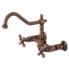 an antique style faucet with two spouted handles and nozzles