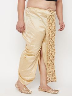 Vastramay Men's Plus Size Gold Cotton Blend Embroidered Traditional Dhoti Embrace tradition and comfort with this elegant men's dhoti. Made from a breathable cotton blend, it features intricate embroidery and a comfortable drawstring closure for a perfect fit. Key Features: Gold cotton blend fabric Beautiful embroidered design Comfortable mid-rise fit Drawstring closure for adjustability Specifications: Bottom Pattern: Embroidered Bottom Closure: Slip-On Waistband: Elasticated with Drawstring Ma Traditional Eid Bottoms With Drape, Traditional Drape Bottoms For Eid, Traditional Bottoms With Zari Work For Eid, Traditional Ankle-length Bottoms For Diwali, Traditional Ankle-length Wedding Bottoms, Traditional Resham Embroidery Ankle-length Bottoms, Traditional Ankle-length Bottoms With Resham Embroidery, Traditional Fitted Bottoms With Zari Work, Fitted Traditional Bottoms With Zari Work