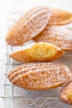 powdered sugar cookies cooling on a wire rack