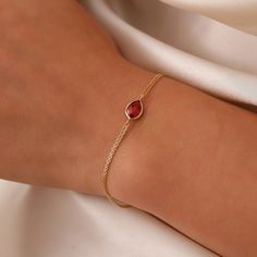 14K Gold Oval Ruby Bracelet, Minimalist Ruby Bracelet, 14K Real Gold Anniversary Bracelet, Handmade 14K Drop Ruby Bracelet, Anniversary Bracelet, Birthday Gift, Christmas Gift, Solid Gold Bracelet, Minimalist Gold Bracelet, Wedding Bracelet, Valentine's Day Gift, Oval Bracelet "Material: SOLİD GOLD (No Gold Filled Or No Gold Plated)" "KARAT: 14K (585) "Bracelet Length: 10 MM "Bracelet Width: 7 MM "Available Gold Color: (Yellow Gold, White Gold, Rose Gold) "The certificate will be sent with the p Dainty Ruby Jewelry, Oval Rose Gold Bracelet For Gift, Oval Rose Gold Bracelet As Gift, Rose Gold Oval Bracelet Gift, Gold And Ruby Necklace, Yellow Gold Teardrop Bracelets For Gift, Minimalist Oval Jubilee Bracelet, Teardrop Yellow Gold Bracelet Gift, Dainty Oval Bracelets As Gift