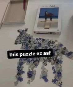 this puzzle ez asf is on the floor next to a mouse and keyboard