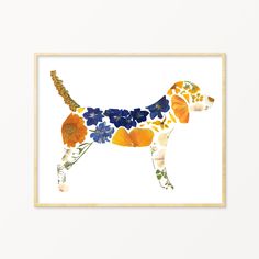 a dog with flowers on it's body is framed in a wooden box frame