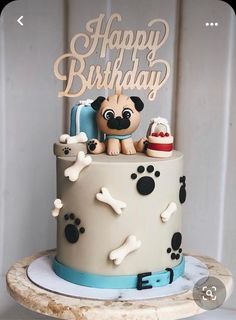 a birthday cake with a dog on top