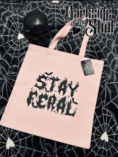 Carry all of your spooky things in this cute soft pink color tote bag. Use it as for your personal things, school items or anything you can think of. Product Description: - Color: SOFT PINK - 12oz Heavy Canvas - Standard Size - Standard Length Web Handles - Size: 15" W x 16" H - machine wash with cold water and like colors, tumble dry low - tote bag has two pockets in the front to place your phone/drink etc. * Design is made from black plastisol ink (screen print)  * Every tote that I make is hand made with love 🖤 and I ALWAYS make sure that my tote's are in perfect condition 😁 only the best for you guys 🖤 Each tote comes with care instructions... I recommend hand washing in cold water only to ensure your tote lasts as long as possible  Thank you so much for supporting my Etsy Shop 🖤 - Alternative Style Halloween Bags For Daily Use, Alternative Halloween Bags For Daily Use, Goth Tote Bag, Soft Pink Color, Pink Canvas, School Items, Soft Pink, Canvas Tote, Purses And Handbags