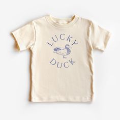 This Lucky Duck graphic tee is 100% cotton, has a tear away tag for your child's comfort and comes in 3 natural Bella Canvas colors. In sizes 2T-5T, make this Silly Duck Shirt the cutest birthday theme shirt or everyday trendy tee! DETAILS .100% Cotton .Bella Canvas tee .Tear away label .Runs true to size .Props in any photos are not included and are for styling purposes only .Colors may slightly vary from styled photos  SIZING This graphic tee design will be printed on a Bella Canvas shirt that is high quality, comfortable and so soft! Sizing runs true to size (please refer to the size chart for exact measurements). If you'd like a more oversized look I would recommend ordering a size up. If you prefer a tighter fit, size down. Sizes are for toddlers and range from 2T-5T. CARE .Turn insid The Snuggly Duckling Shirt, Duck Hunting Birthday, Silly Duck, One Lucky Duck, Duck Hunting Shirts, Duck Graphic, Hunting Birthday, Silly Shirt, Duck Birthday