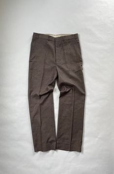 "Vintage New with Tags Sears Regular Fit Trousers Size: 36 x 31 Reg. Era: 1980's Material: 50% Polyester, 25% Rayon, 25% Acrylic Made in USA Details: New with Tags - Deadstock Sears Regular Fit Brown Trousers with Flap Pocket Back Pocket. All New, Perfect Condition. Flat Measurements - Waist - 17\" Inseam - 31\" Leg Opening - 9.5\"" Retro Fitted Winter Bottoms, Retro Fitted Bottoms For Winter, Retro Relaxed Fit Brown Bottoms, Vintage Relaxed Fit Pants For Winter, Retro Brown Bottoms With Relaxed Fit, Fitted Vintage Brown Bottoms, Brown Vintage Pants For Winter, Vintage Brown Winter Pants, Brown Fitted Flat Front Bottoms